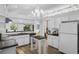 Spacious kitchen with modern white cabinetry and dark countertops, showcasing bright and airy feel at 1756 Waterbeach Ct, Apopka, FL 32703