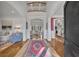 Grand foyer with soaring ceilings, hardwood floors, and a view into the living spaces creating a stunning entrance at 1911 Stonehurst Rd, Winter Park, FL 32789