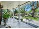 Inviting front porch with classic white columns and a welcoming view of the landscaped front yard at 1911 Stonehurst Rd, Winter Park, FL 32789