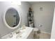 Bathroom with updated vanity, toilet, and shower with decorative shelving at 1972 Lake Atriums Cir # 200, Orlando, FL 32839