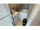 A practical laundry area with a washer, dryer, and storage for supplies at 1972 Lake Atriums Cir # 200, Orlando, FL 32839