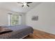 Bedroom with wood floors, vaulted ceiling, and lots of natural light at 2046 Ambergris Dr, Orlando, FL 32822