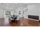 Bright dining room with wood floors, a modern table set, and sliding glass doors to the outside at 2046 Ambergris Dr, Orlando, FL 32822