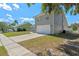 Charming two-story home with a white garage door and well-maintained front yard at 2046 Ambergris Dr, Orlando, FL 32822