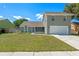 Two story home with a well maintained lawn and attached two car garage at 2046 Ambergris Dr, Orlando, FL 32822