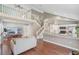 Inviting living room with vaulted ceilings, staircase, and an open flow to the modern kitchen at 2046 Ambergris Dr, Orlando, FL 32822