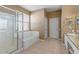 Bathroom featuring tub, walk-in shower and light tile flooring at 2248 Wyndham Palms Way, Kissimmee, FL 34747