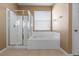 Bathroom featuring a walk in shower and tub at 2248 Wyndham Palms Way, Kissimmee, FL 34747