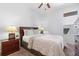 Bedroom featuring a ceiling fan and bedside table at 2248 Wyndham Palms Way, Kissimmee, FL 34747