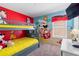 Fun bedroom for children features a colorful mural and bunk beds, creating a whimsical and playful space at 2248 Wyndham Palms Way, Kissimmee, FL 34747