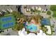 Aerial view of community amenities including pool, tennis courts, and basketball court at 2248 Wyndham Palms Way, Kissimmee, FL 34747