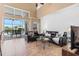 Bright and airy living room with tile floors, a large window, and comfortable leather sofas at 2248 Wyndham Palms Way, Kissimmee, FL 34747