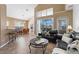 Inviting living room with tile flooring, comfortable leather seating, and sliding glass doors to lanai at 2248 Wyndham Palms Way, Kissimmee, FL 34747