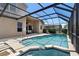 Relaxing screened-in pool area with a hot tub, comfortable seating, and a covered patio at 2248 Wyndham Palms Way, Kissimmee, FL 34747