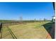 Well-maintained backyard with a black fence and serene view at 2342 Gold Dust Dr, Minneola, FL 34715