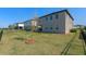 View of the backyard showcasing the exterior of the house and landscaping at 2342 Gold Dust Dr, Minneola, FL 34715