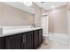 Bathroom featuring a single vanity sink, shower, and toilet at 2342 Gold Dust Dr, Minneola, FL 34715