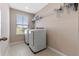 Laundry room featuring modern appliances and a large window at 2342 Gold Dust Dr, Minneola, FL 34715