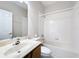 Bathroom with vanity, toilet, and shower-tub combo at 253 Lake Cassidy Dr, Kissimmee, FL 34759