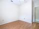 Clean, empty bedroom with wood laminate flooring, neutral walls, and ceiling fan at 253 Lake Cassidy Dr, Kissimmee, FL 34759