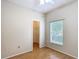 Bedroom features wood floors, ceiling fan, a window, and walk-in closet at 253 Lake Cassidy Dr, Kissimmee, FL 34759