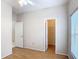 Bedroom features wood floors, ceiling fan, a window, walk-in closet, and ensuite bath at 253 Lake Cassidy Dr, Kissimmee, FL 34759