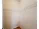 Walk-in closet with wood floor and shelving at 253 Lake Cassidy Dr, Kissimmee, FL 34759
