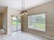 Open dining area with view of the lanai at 253 Lake Cassidy Dr, Kissimmee, FL 34759