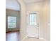 Welcoming foyer with a glass-paneled front door and a view into the living area at 253 Lake Cassidy Dr, Kissimmee, FL 34759