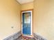 Inviting front entrance with a glass-paneled door and decorative welcome mat at 253 Lake Cassidy Dr, Kissimmee, FL 34759