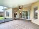 A view of the screened patio that has an airy ceiling fan and access to the home at 253 Lake Cassidy Dr, Kissimmee, FL 34759