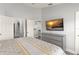 Bedroom with grey dresser and a wall-mounted TV at 2537 Renshaw St, Kissimmee, FL 34747