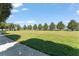 Community green space and pathway offering views of the surrounding landscape at 2537 Renshaw St, Kissimmee, FL 34747