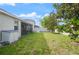 Expansive backyard featuring lush green grass, privacy fence, and shade trees providing a serene outdoor space at 3242 Irish Peach Dr, Winter Garden, FL 34787