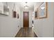 Entryway featuring dark wood-look flooring, neutral walls, and decor at 3242 Irish Peach Dr, Winter Garden, FL 34787