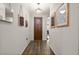 Stylish foyer featuring wood floors, decor, and a view into the home at 3242 Irish Peach Dr, Winter Garden, FL 34787