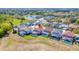 Aerial shot showcasing the home's location within a neighborhood with many houses and pools in the backyard at 368 Sand Ridge Dr, Davenport, FL 33896