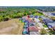 High-angle perspective of a home boasting a private pool, complemented by lush green surroundings and serene atmosphere at 368 Sand Ridge Dr, Davenport, FL 33896