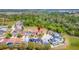 Aerial view of a residential neighborhood featuring lush green trees and landscaping, showing the surrounding area at 368 Sand Ridge Dr, Davenport, FL 33896