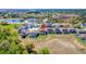 Scenic aerial view of a community with well-maintained homes and lush landscapes, with nearby ponds at 368 Sand Ridge Dr, Davenport, FL 33896