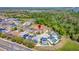 Aerial shot shows the home's location in a serene neighborhood with proximity to roads, houses, and green areas at 368 Sand Ridge Dr, Davenport, FL 33896