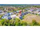 Picturesque aerial view of a residential neighborhood, showcasing well-manicured lawns and nearby golf course at 368 Sand Ridge Dr, Davenport, FL 33896