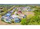 Aerial view shows houses in a quiet neighborhood with pools in the backyards at 368 Sand Ridge Dr, Davenport, FL 33896