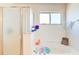 Relaxing bathroom featuring a soaking tub with a window for natural light at 368 Sand Ridge Dr, Davenport, FL 33896