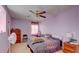 A bedroom with a ceiling fan and two windows at 368 Sand Ridge Dr, Davenport, FL 33896