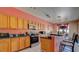 Kitchen features a breakfast bar overlooking stainless steel appliances and bright cabinets for a modern touch at 368 Sand Ridge Dr, Davenport, FL 33896