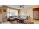 Bright living room with neutral tones, a patterned rug, and large window at 368 Sand Ridge Dr, Davenport, FL 33896