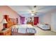 Expansive main bedroom with wood furniture and ceiling fan at 368 Sand Ridge Dr, Davenport, FL 33896