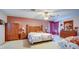 Spacious main bedroom with wood furniture and a ceiling fan at 368 Sand Ridge Dr, Davenport, FL 33896