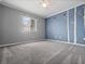 Bedroom featuring carpeted floors, a ceiling fan, and nature-themed wall art at 3764 Pinehurst St, Deltona, FL 32738